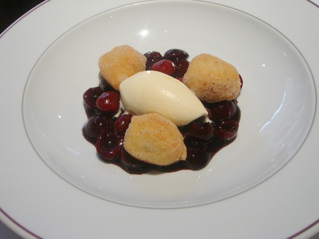 Poached cherries with soufflé beignets